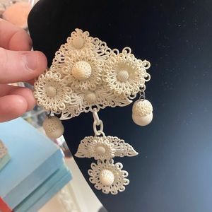 Antique white brooch